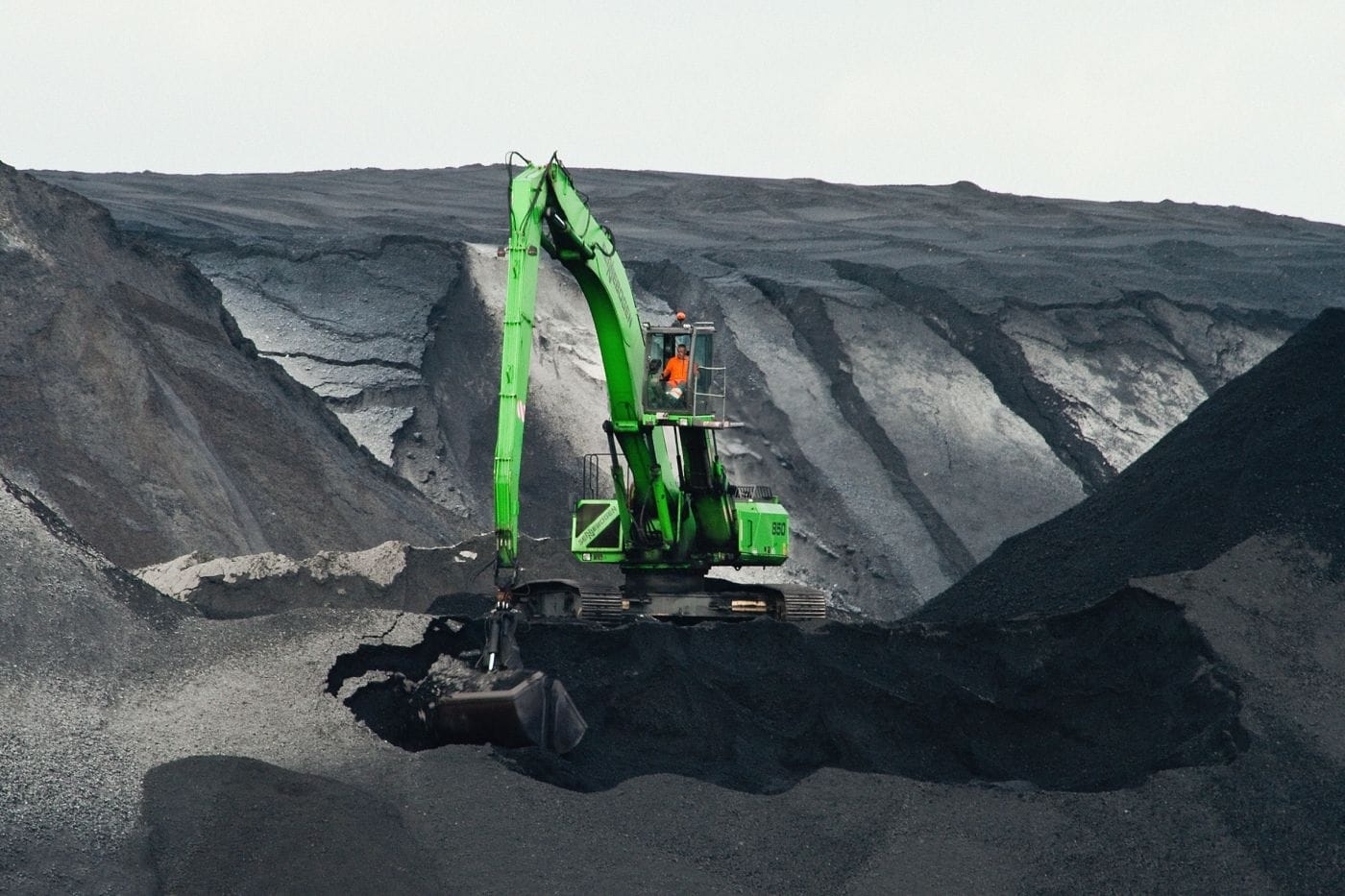 green-excavator-digging.jpg