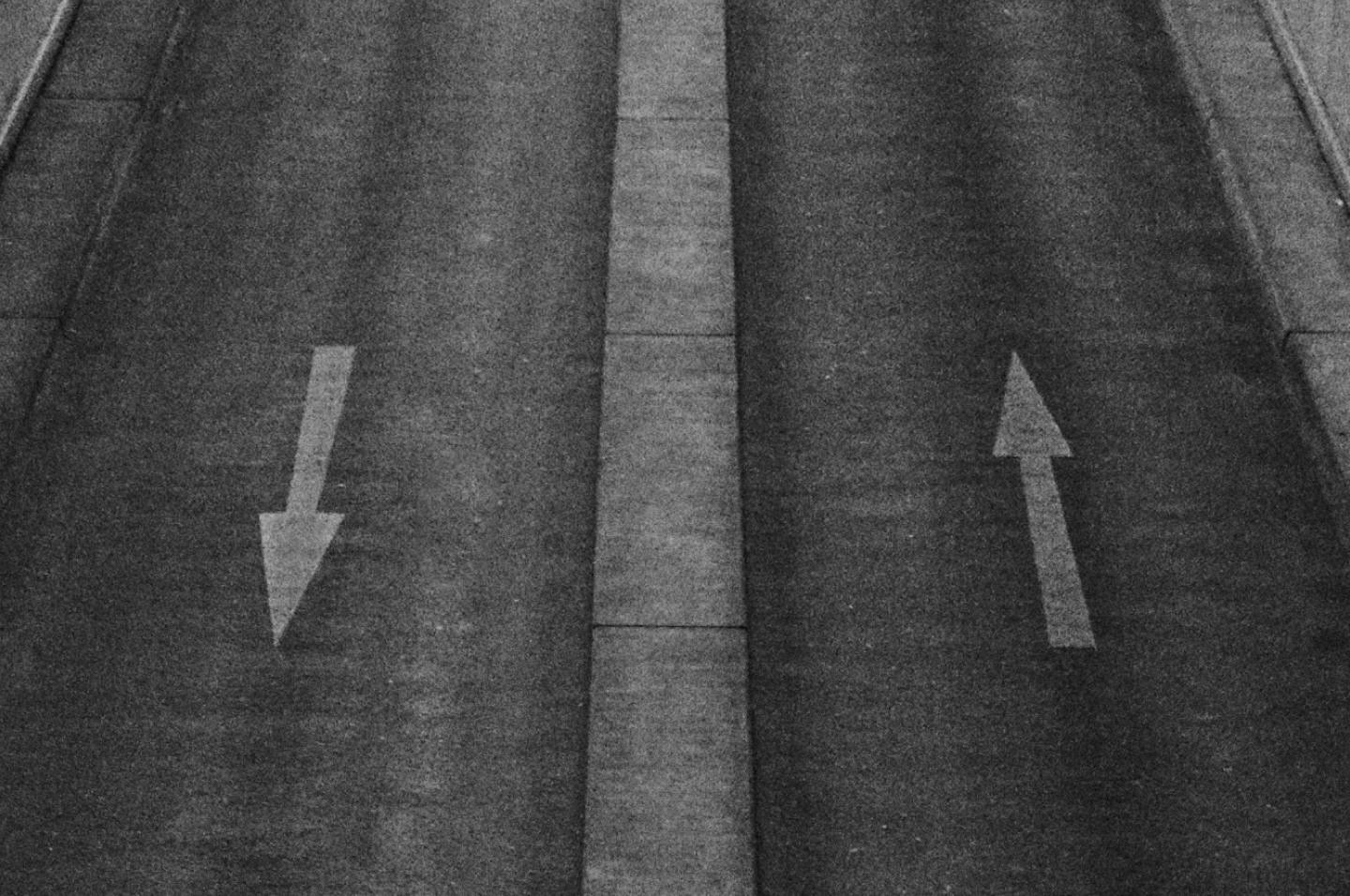 A metaphor for value investing – two arrows on a road, one going up and one going down.