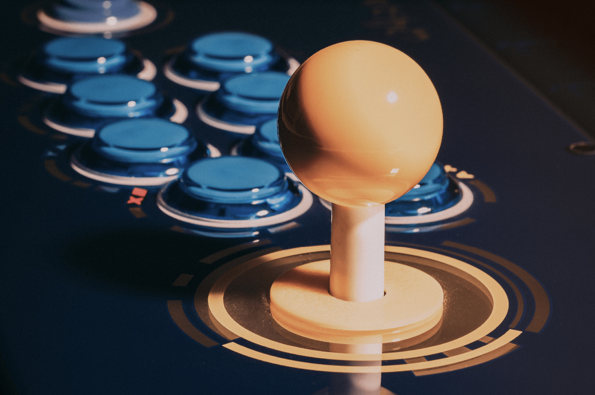 Old school arcade game with yellow and blue buttons.