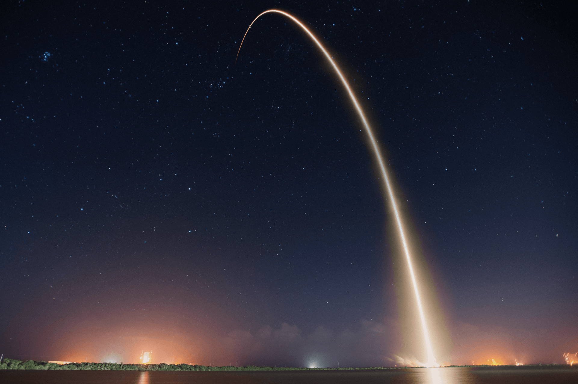 A rocket satellite being launched.